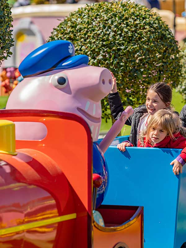Children enjoying a Peppa Pig World ride at Paultons Park.