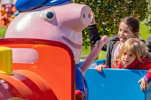 Children enjoying a Peppa Pig World ride at Paultons Park.