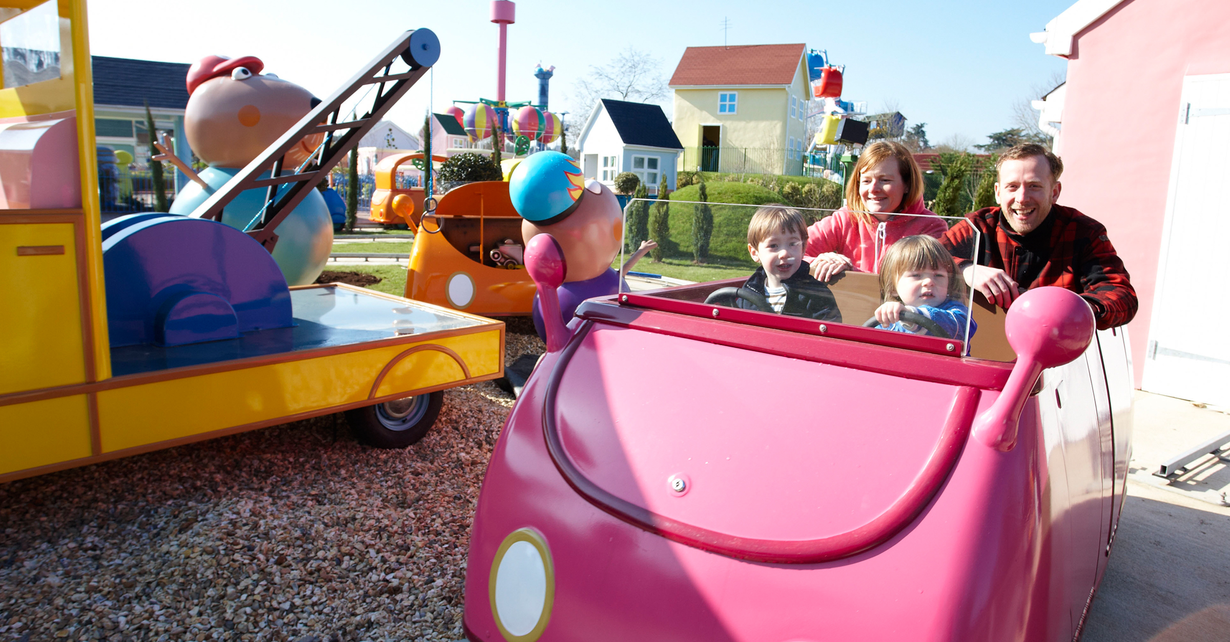 Family enjoying a Peppa Pig World ride during a November break