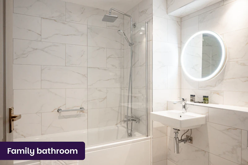 Modern family bathroom with shower at The Hermitage Hotel